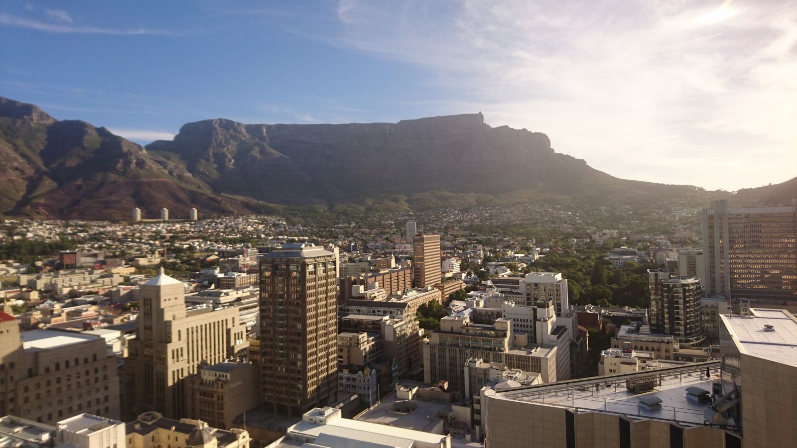 The Cape Town city centre seen from above, with Table Mountain behind the buildings.
